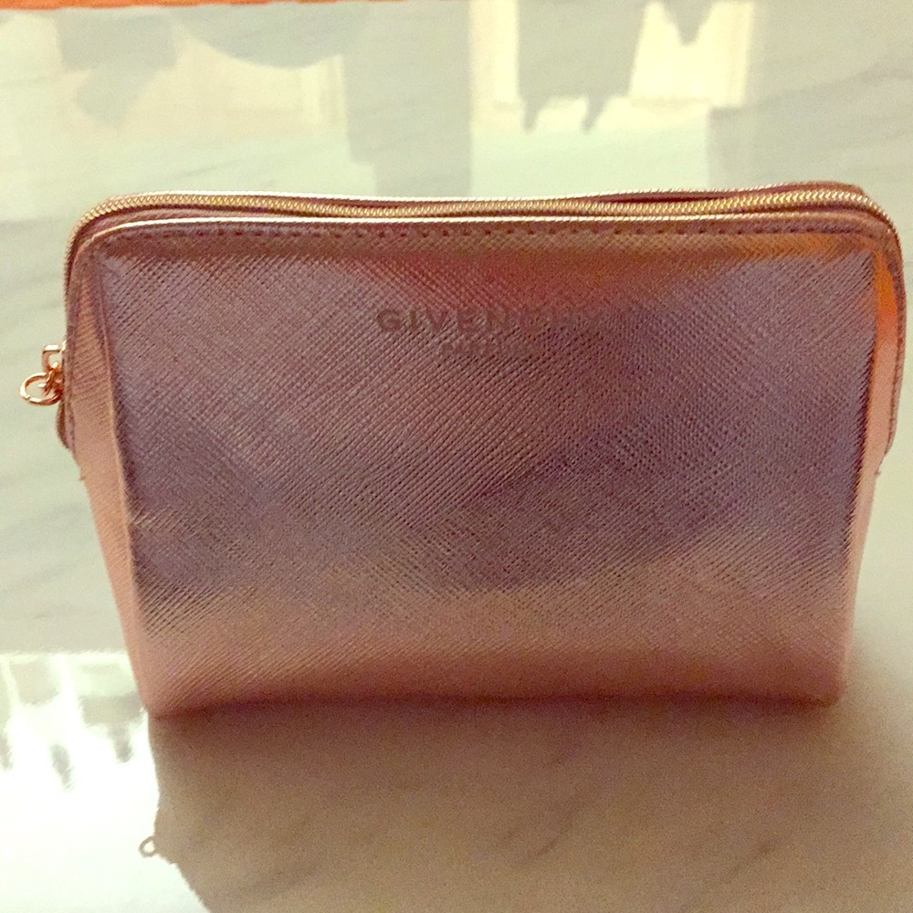 Brand new Givenchy gold make up case.